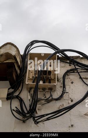 An Open Electrical Fuse Box And Distributor With Many Cables Leading In And Out In An Unsafe And Haphazard Manner Stock Photo Alamy