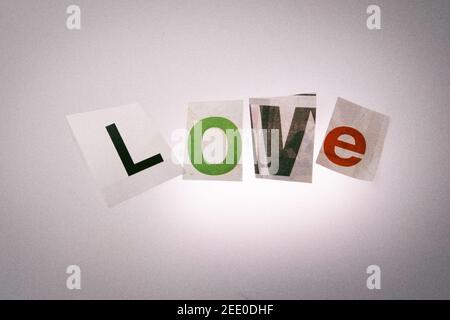 The word LOVE using cut-out paper letters in the ransom note effect typography Stock Photo
