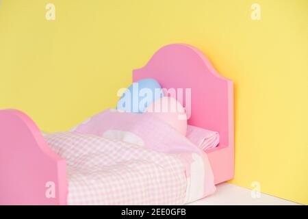 Lovely couple eggs sleeping in an embrace in bed. holding hands.Easter holiday concept with cute eggs with funny faces. Different emotions and Stock Photo