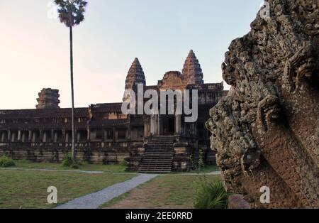 Exterior decoration with in the background the domes of the temple of Angkor Wat, Cambodia  Stock Photo