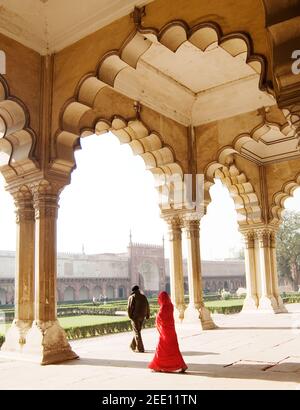 Man and woman walking through Agra Fort, Agra, India Stock Photo