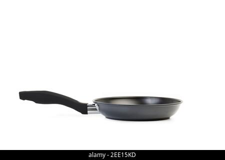 A black frying pan on a white background with copy space Stock Photo