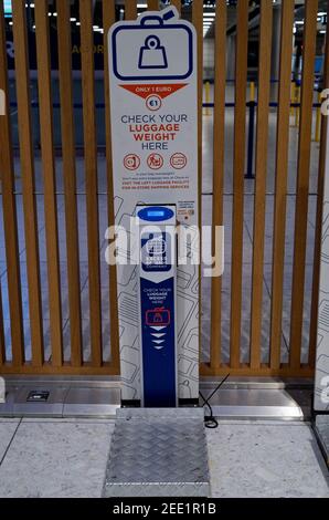DUBLIN, IRELAND - Jan 11, 2020: A vertical shot of self service digital scale ready to check a luggage weight at the hall of Terminal 1 in Dublin Airp Stock Photo
