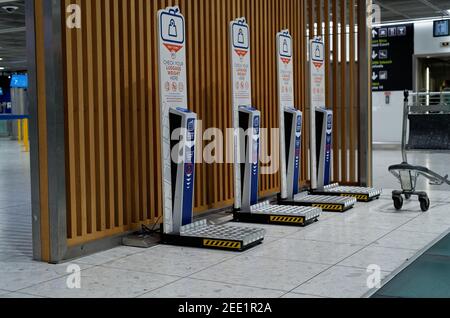 DUBLIN, IRELAND - Jan 11, 2020: Row of self service digital scales to check luggage weight at the empty hall of Terminal 1 in Dublin Airport. Stock Photo