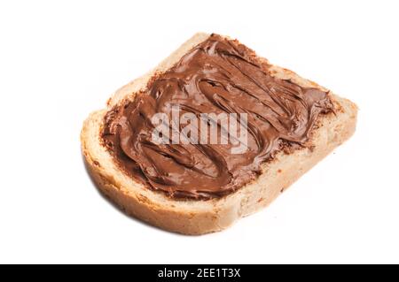 Slice of cereal bread with chocolate hazelnut cream spread isolated on white background Stock Photo
