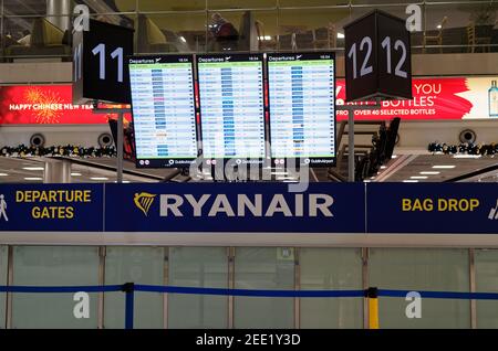 DUBLIN, IRELAND - Jan 11, 2020: Digital departures boards at the Ryanair checking in area at Terminal 1, in Dublin Airport. Stock Photo