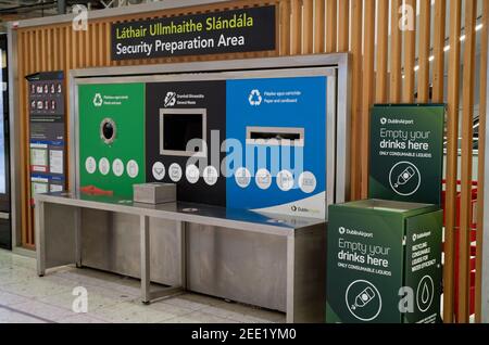 DUBLIN, IRELAND - Jan 11, 2020: Security preparation area provided by Dublin Airport at Terminal 1. Instructions are written in English and Irish lang Stock Photo