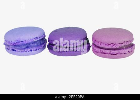 three macaroons in blue, violet and purple, isolated on white background Stock Photo
