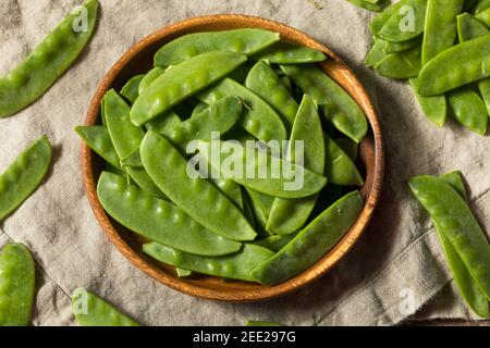 Raw Green Organic Snow Peas Ready to Eat Stock Photo