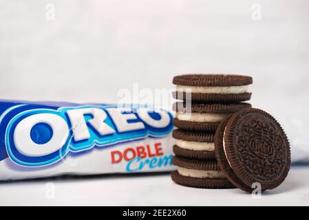 OREO sandwich cream biscuits with pack on white background Stock Photo