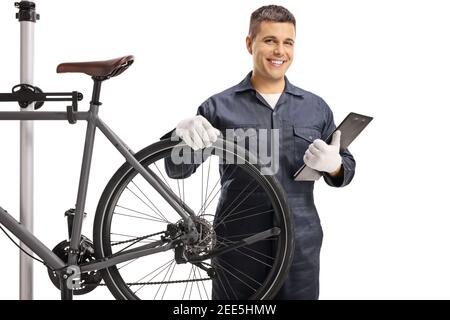 Bicycle mechanic with a bicycle smiling at camera isolated on white background Stock Photo