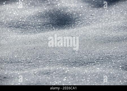 Frozen snow shining in the winter sun Stock Photo