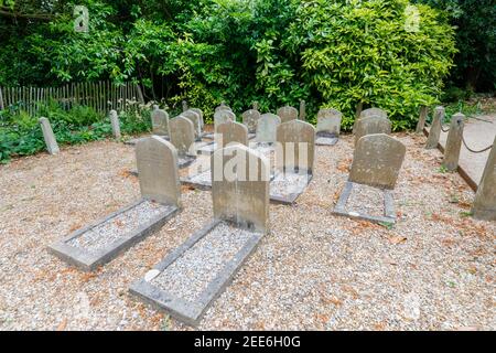 Pet cemetery with carved headstones for dogs at Polesden Lacey, Great Bookham, Surrey, south-east England
