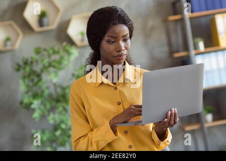 Photo Portrait of African American Girl Pulling Hoodie Strings Laces  Isolated on Vivid Yellow Colored Background Stock Image - Image of black,  multiethnic: 230592381