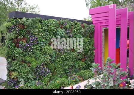 LONDON, UK - 20 MAY 2019: Edible green wall made of flowers and vegetables at The Montessori Centenary Children's Garden at Chelsea Flower Show Stock Photo