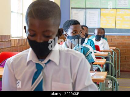 Johannesburg, South Africa. 15th Feb, 2021. Pupils have a class at a primary school in Johannesburg, South Africa, Feb. 15, 2021. Over 20,000 public schools in South Africa were reopened in accordance with strict adherence to the COVID-19 protocol on Monday. Credit: Matthew Martin Brink/Xinhua/Alamy Live News Stock Photo