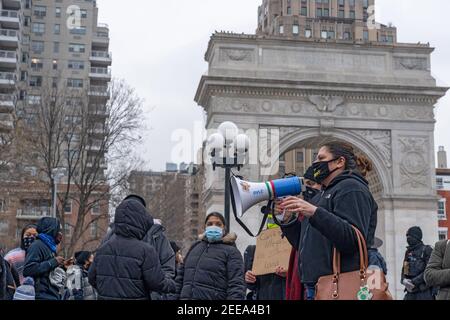 NEW YORK, NY - FEBRUARY 15: Activist speaks in Washington Square during an Abolish ICE (Immigration and Customs Enforcement) protest on February 15, 2021 in New York City.   Free Them All by Abolish ICE Coalition marched for Javier Castillo Maradiaga through downtown New York City. Mr. Maradiaga, a 27-year-old Bronx man who has lived in the U.S. since he was 7 years old was set to be deported by the U.S. Immigration and Customs Enforcement (ICE). Stock Photo