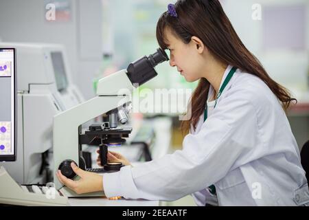 Medical doctor working for analyzing blood samples in laboratory of scientific research. Concept for biology chemistry HIV hematology. Stock Photo