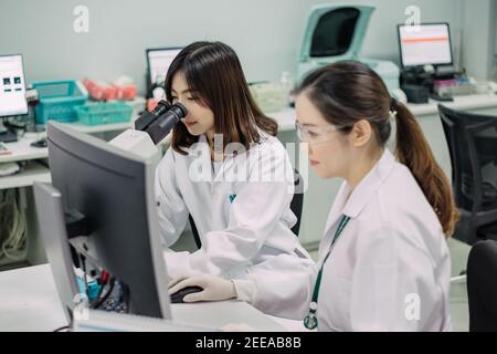 Medical doctor working for analyzing blood samples in laboratory of scientific research. Concept for biology chemistry HIV hematology.