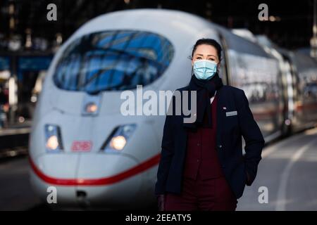 Cologne, Germany. 11th Feb, 2021. Nicole Perlinger dos Santos, former stewardess at Lufthansa subsidiary Germanwings and now a Deutsche Bahn train attendant, stands in front of an ICE train. Job prospects for pilots, flight attendants and aircraft technicians have deteriorated massively in the Corona crisis. In the reorientation, a state-owned company apparently offers advantages. (to dpa 'From the jet to the ICE - Flying personnel highly welcome at Bahn') Credit: Rolf Vennenbernd/dpa/Alamy Live News Stock Photo