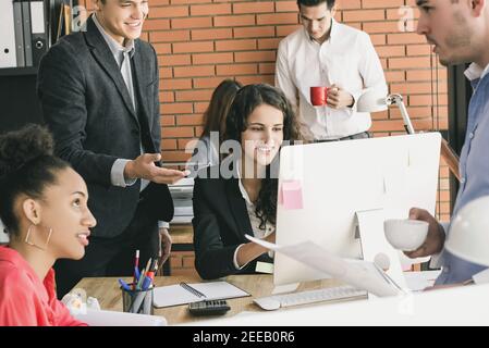 Young multiethnic group of business people working in shared office space Stock Photo