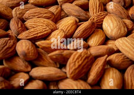 Top view of almonds in a heap. Use for Healthy snack concept. Stock Photo