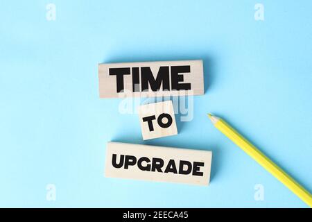 Time To Upgrade words, blue background selective focus. Technology business concept Stock Photo