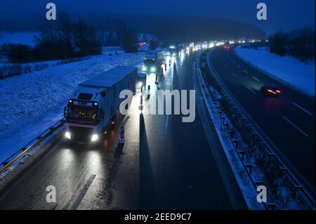 Waidhaus, Germany. 16th Feb, 2021. Trucks standing in a traffic jam near the German-Czech border. The tightened German entry rules at the border with the Czech Republic to protect against dangerous variants of the coronavirus came into force in the night of 14.02.2021. Credit: Armin Weigel/dpa/Alamy Live News Stock Photo