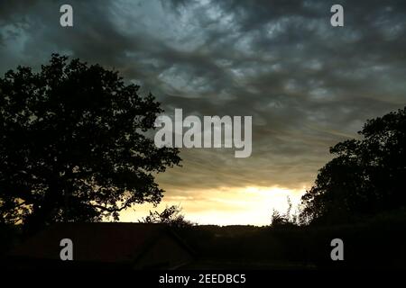 Dramatic grey clouds at sunset, Kent Stock Photo