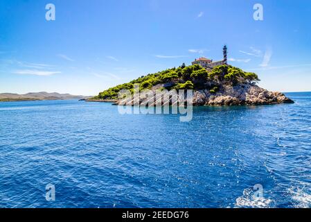 Croatian island with lighthouse on Vela Sestrica near Kornati, Adriatic Sea, Croatia, panoramic view. Vacation travel concept. Stock Photo