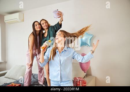 Three female friends having a good time Stock Photo