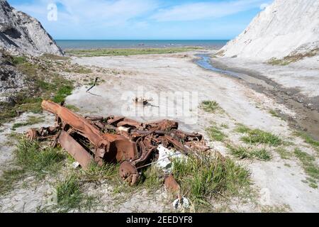 Remains of abandoned car, Lake Ferry, Wairarapa, North Island, New Zealand Stock Photo