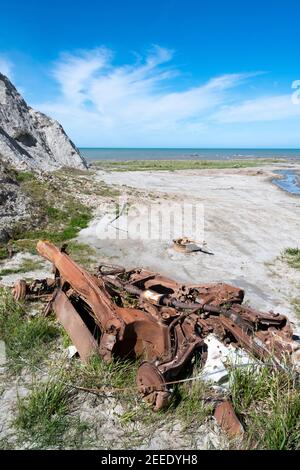 Remains of abandoned car, Lake Ferry, Wairarapa, North Island, New Zealand Stock Photo