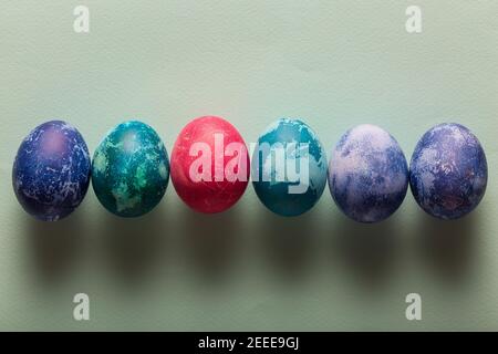 Multicolored Easter eggs on a blue background Stock Photo