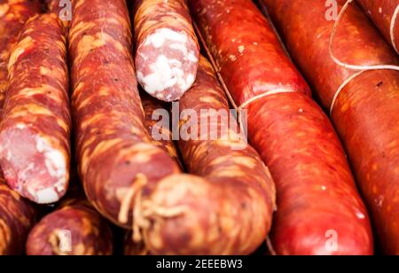 many sausages in natural casing as a background Stock Photo