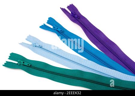 Four multi-colored zipper isolated on white background Stock Photo