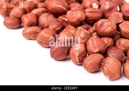 peeled hazelnuts isolated on white background macro Stock Photo