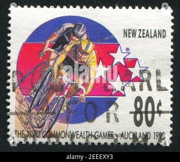 NEW ZEALAND - CIRCA 1989: stamp printed by New Zealand, shows Cyclists at 14th Commonweath Games in Auckland in 1990, circa 1989 Stock Photo