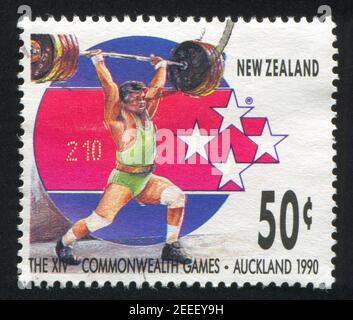 NEW ZEALAND - CIRCA 1989: stamp printed by New Zealand, shows Weightlifter at 14th Commonweath Games in Auckland in 1990, circa 1989 Stock Photo