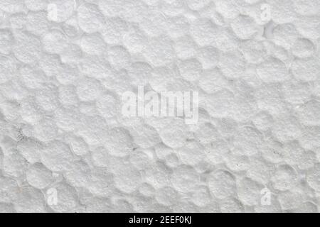 White polystyrene foam surface with closed cells closeup photo. Artificial texture with cell structure. Carbon polymer macrophoto. Abstract backdrop f Stock Photo