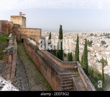 Granada, Spain - 5 February, 2021: the Alcazaba fortress in the Alhambra and a view of the rooftops of the city Stock Photo