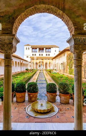 Granada, Spain - 5 February, 2021: the Generalife Palace with the Patio de la Acequia in the Alhambra in Granada