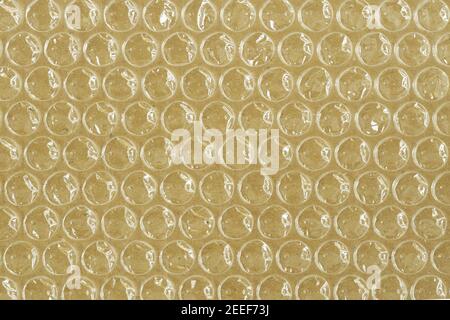 Plastic bubble wrap on cardboard background Stock Photo