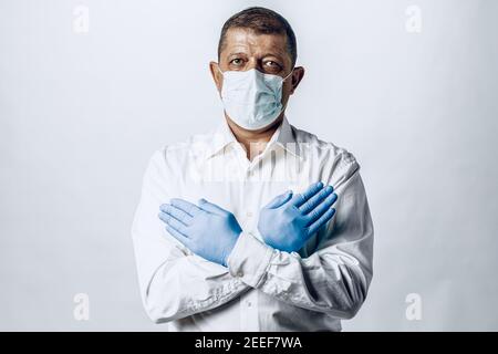 Stop world pandemia of coronavirus. Portrait of a man wearing protective mask Stock Photo
