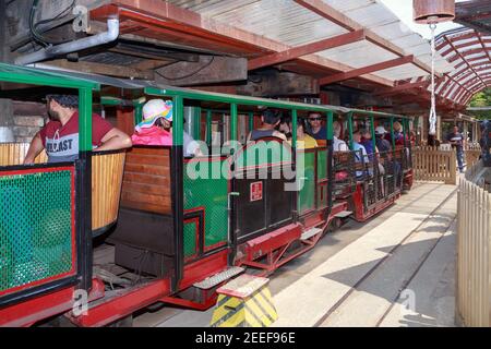 Passengers in carriages at Driving Creek Railway, a tourist attraction near the town of Coromandel, New Zealand Stock Photo