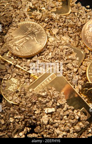 gold in coins, nuggets and ingots Stock Photo