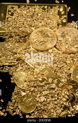 gold in coins, nuggets and ingots Stock Photo