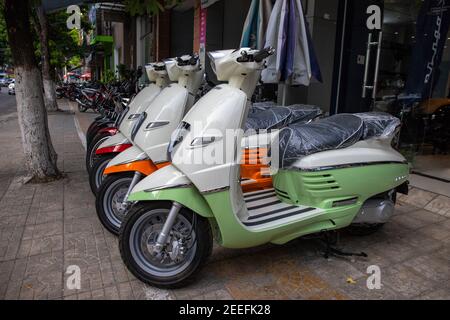 Danang, Vietnam 25 Jul 2019: Peugeot scooter for sale. New french motorbike for country. Vietnam urban Modern asian cityscape. Trav Stock Photo - Alamy
