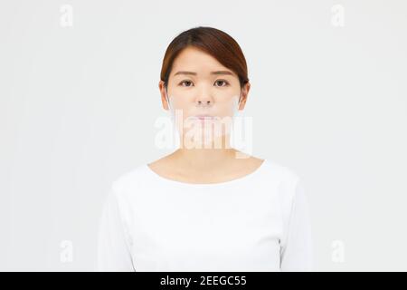 Japanese woman wearing face shield Stock Photo