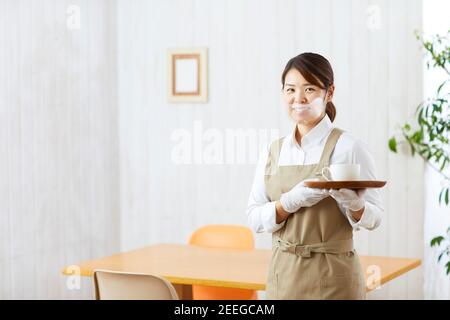 Japanese woman wearing face shield Stock Photo